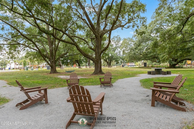 view of property's community with a yard