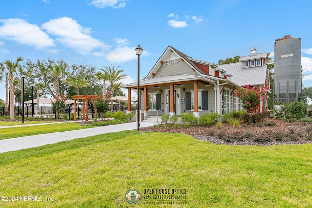 view of front of house featuring a porch and a front yard