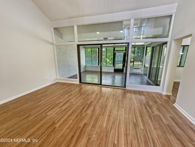 spare room with hardwood / wood-style floors