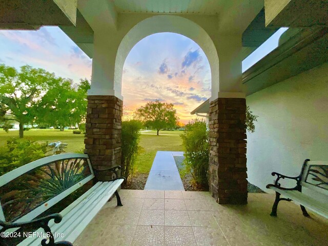 patio terrace at dusk with a yard