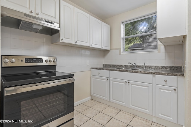 kitchen with white cabinetry, light tile patterned flooring, stainless steel electric range oven, and sink