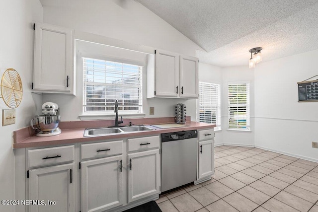 kitchen with dishwasher, white cabinets, plenty of natural light, and sink