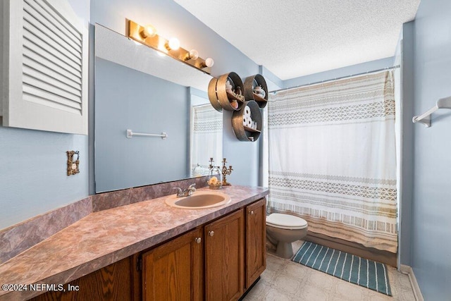 bathroom with vanity, a textured ceiling, toilet, and a shower with shower curtain