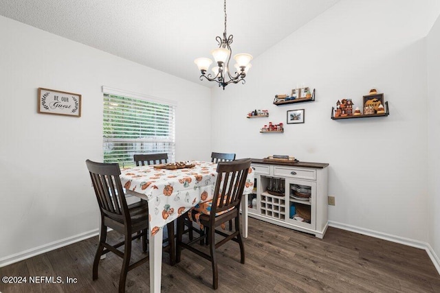 dining space with a chandelier, vaulted ceiling, and dark wood-type flooring