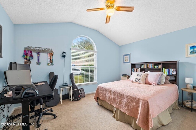 carpeted bedroom with a textured ceiling, ceiling fan, and lofted ceiling