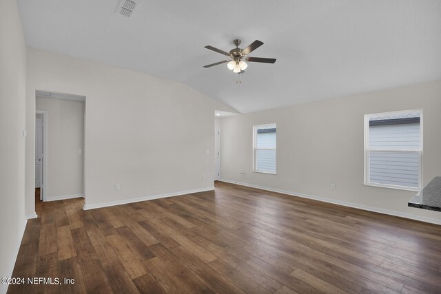 unfurnished room with dark hardwood / wood-style flooring, ceiling fan, and lofted ceiling