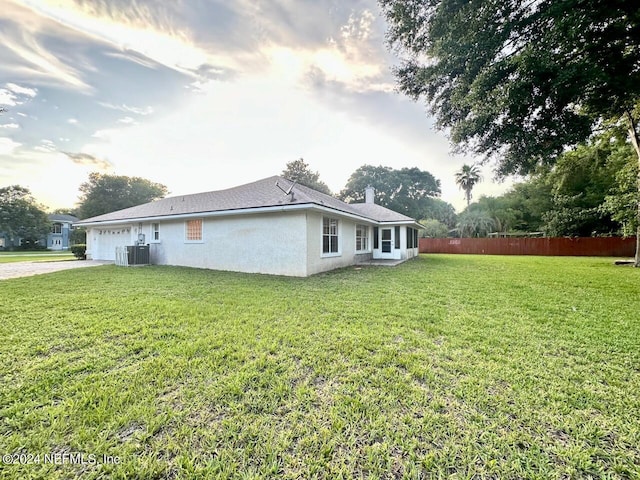 view of home's exterior with a yard