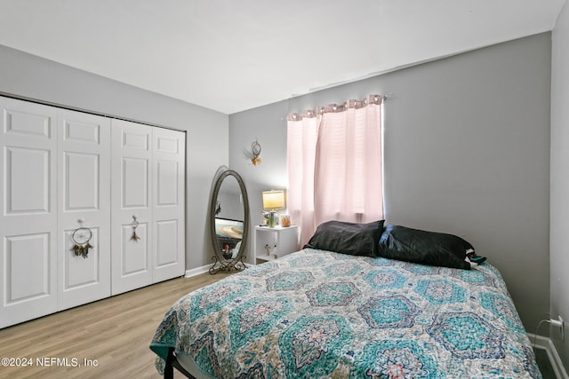 bedroom with a closet and light wood-type flooring