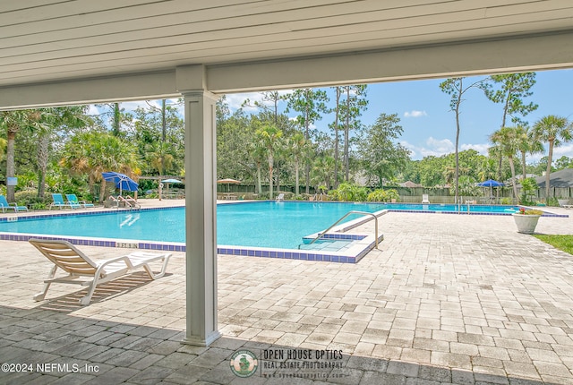 view of swimming pool featuring a patio