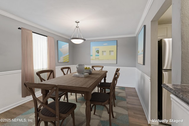 dining area featuring crown molding and dark hardwood / wood-style floors