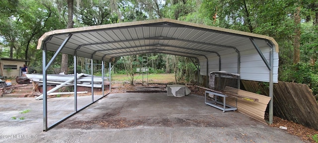 view of vehicle parking featuring a carport