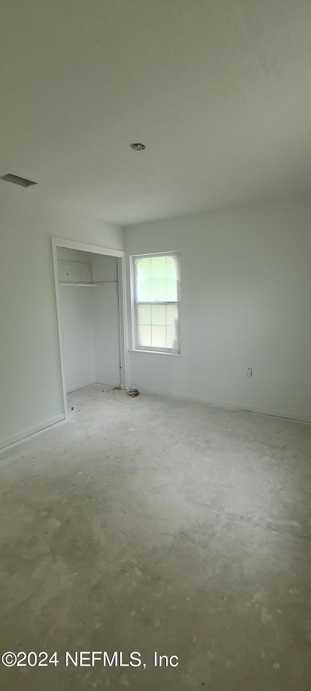 unfurnished bedroom featuring a closet