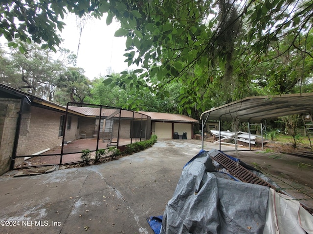 exterior space featuring a garage and a carport