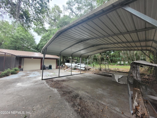 view of vehicle parking featuring a garage and a carport