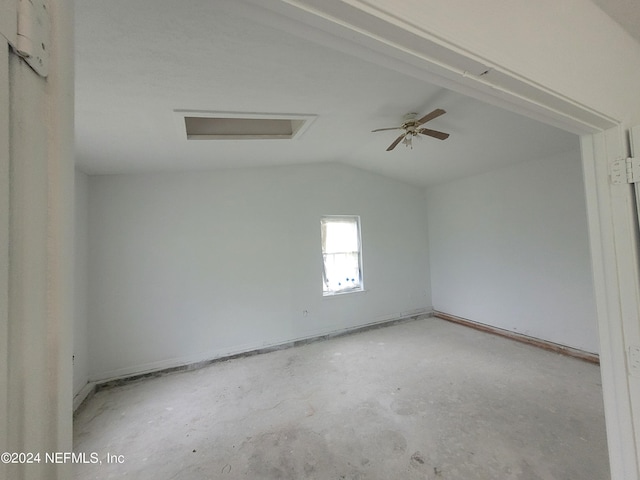 spare room with ceiling fan and vaulted ceiling