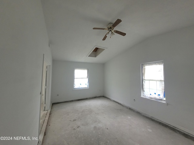 empty room featuring ceiling fan and lofted ceiling