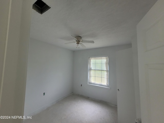 spare room with ceiling fan