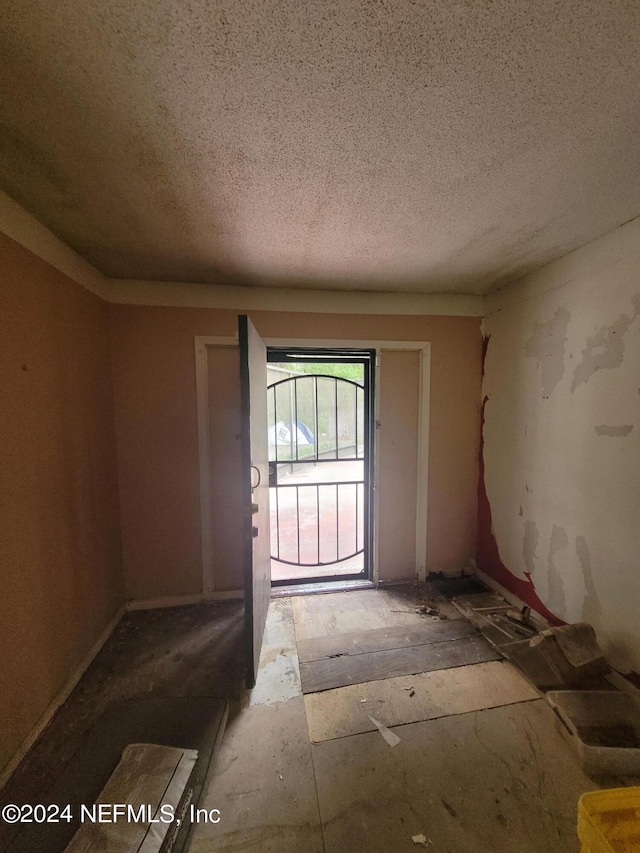 foyer with a textured ceiling