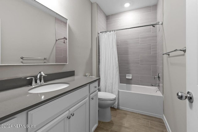 full bathroom with vanity, toilet, and shower / bathtub combination with curtain