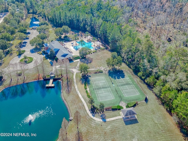 birds eye view of property with a water view