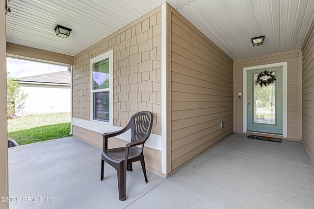 property entrance featuring a porch