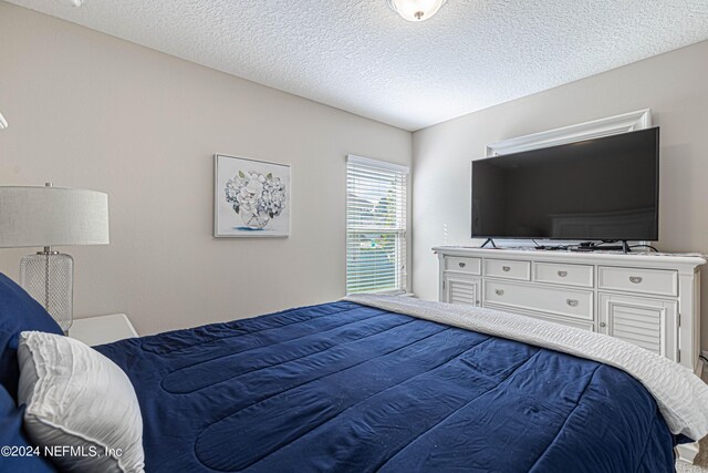 bedroom featuring a textured ceiling