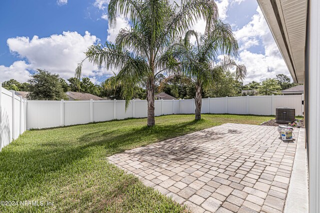 exterior space featuring a patio area and central AC