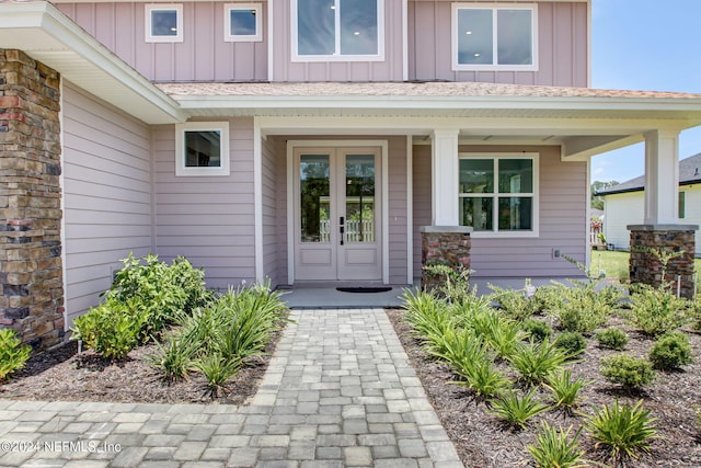 view of exterior entry featuring french doors