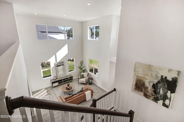 stairs featuring hardwood / wood-style flooring