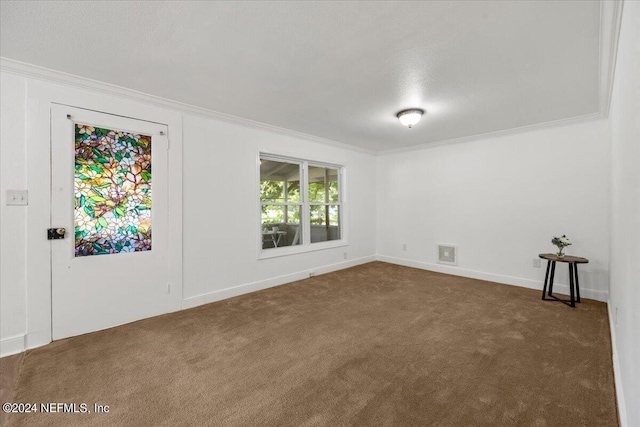 carpeted empty room with crown molding