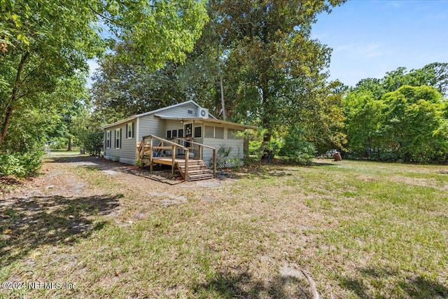 view of yard with a wooden deck