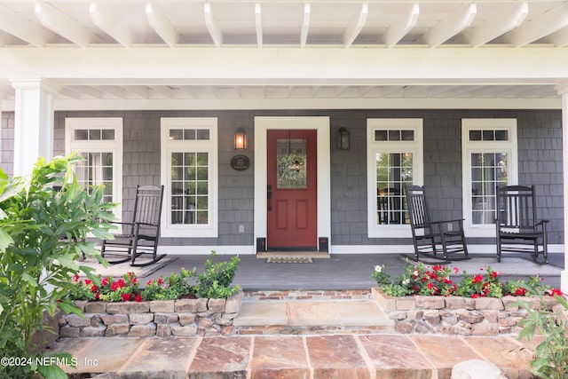 doorway to property with covered porch