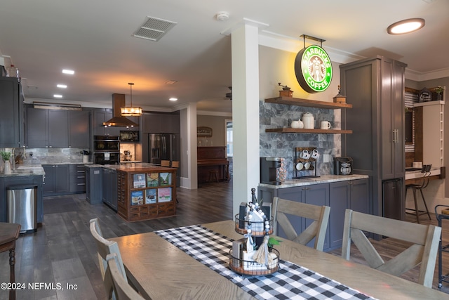 dining area featuring crown molding and dark hardwood / wood-style flooring