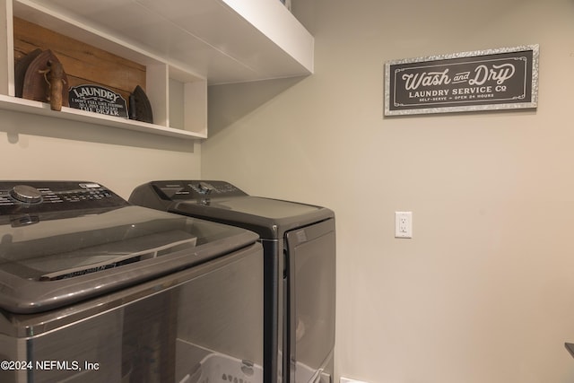 clothes washing area with washing machine and clothes dryer