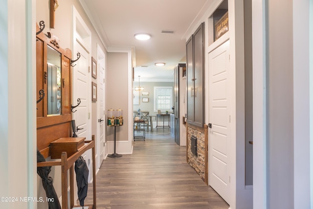 corridor featuring crown molding and dark hardwood / wood-style flooring