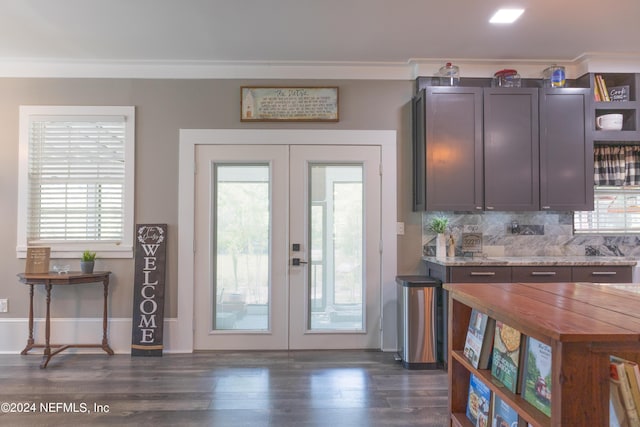 entryway featuring french doors, ornamental molding, dark wood-type flooring, and a wealth of natural light