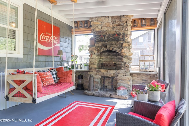 living room featuring concrete flooring and a fireplace