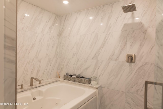 bathroom with independent shower and bath and tile walls