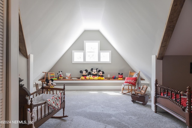 recreation room featuring vaulted ceiling and carpet