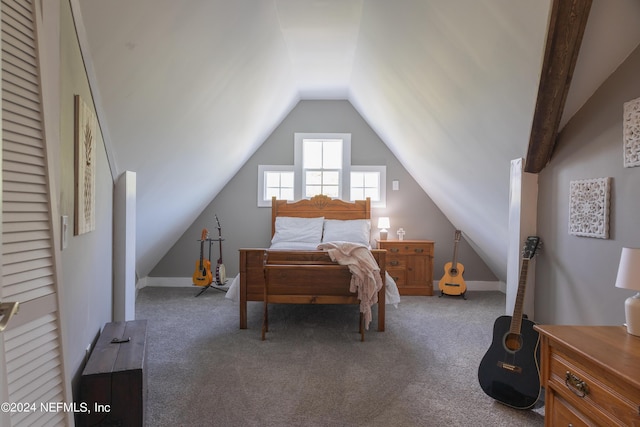 carpeted bedroom with lofted ceiling