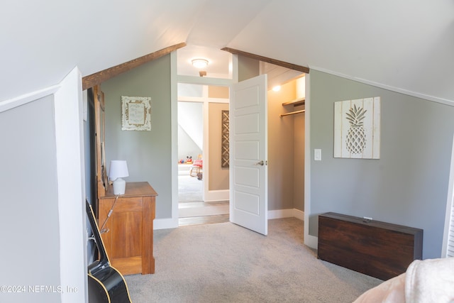 carpeted bedroom with vaulted ceiling