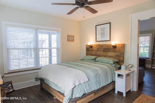 bedroom featuring dark hardwood / wood-style flooring and ceiling fan