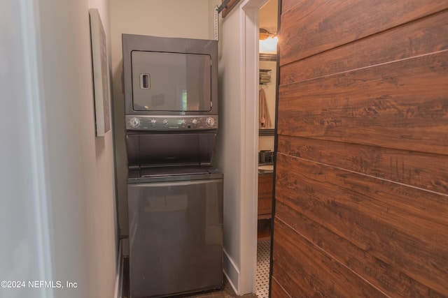 laundry area featuring stacked washing maching and dryer