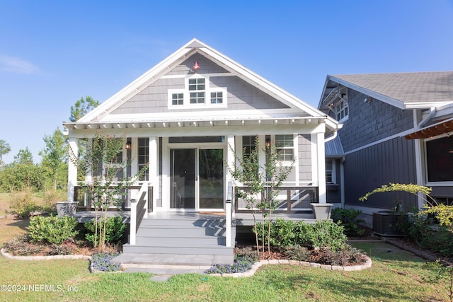 view of front of property featuring central AC and covered porch