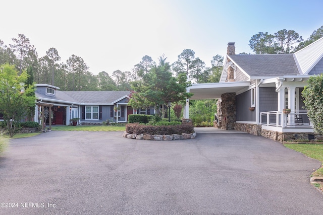 view of front of home with a carport