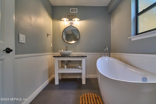 bathroom featuring a tub and sink