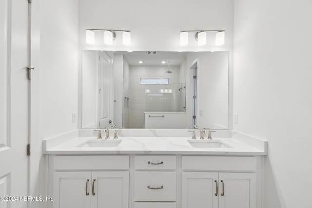 bathroom featuring vanity and an enclosed shower