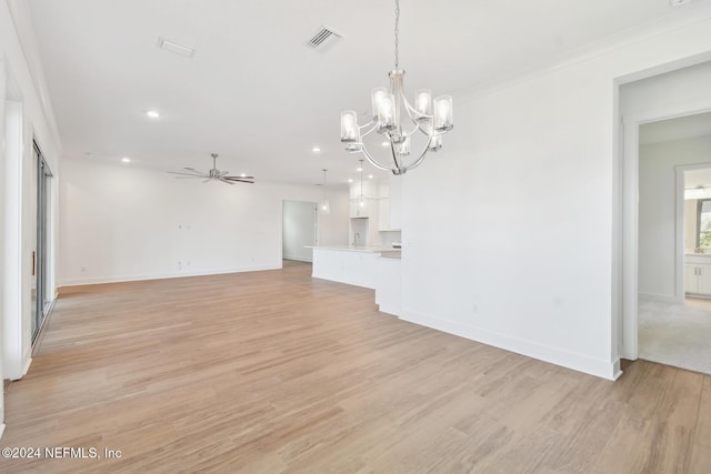 unfurnished living room featuring light hardwood / wood-style floors, ceiling fan with notable chandelier, and ornamental molding