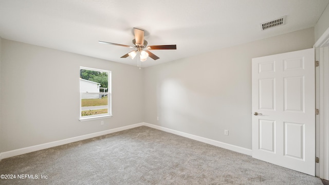 carpeted empty room with ceiling fan