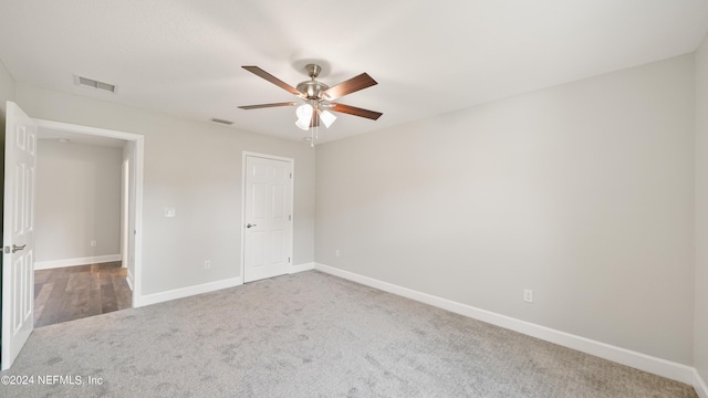 unfurnished bedroom featuring carpet flooring and ceiling fan